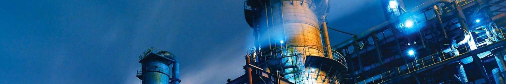 Oil and gas engineers monitoring drilling operations at production site